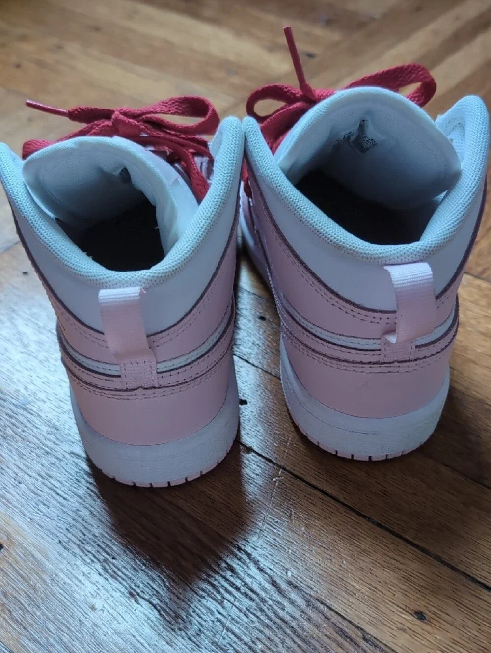 Nike Air Jordan 1 Mid White, Light Pink & Red Accent Sneakers